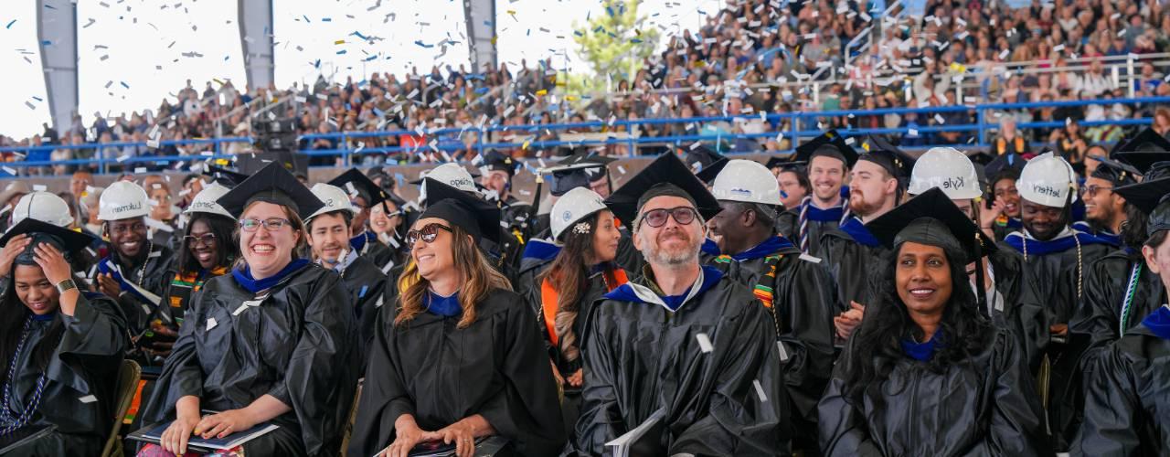 Hero Image of students standing at graduation.